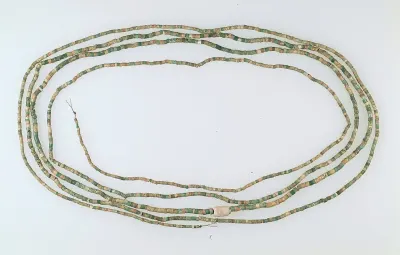 A beaded belt from the Badarian culture (c. 4000 to 3800 BCE), excavated from Tomb 3094 at Matmar. Found still wound around the waist of a m